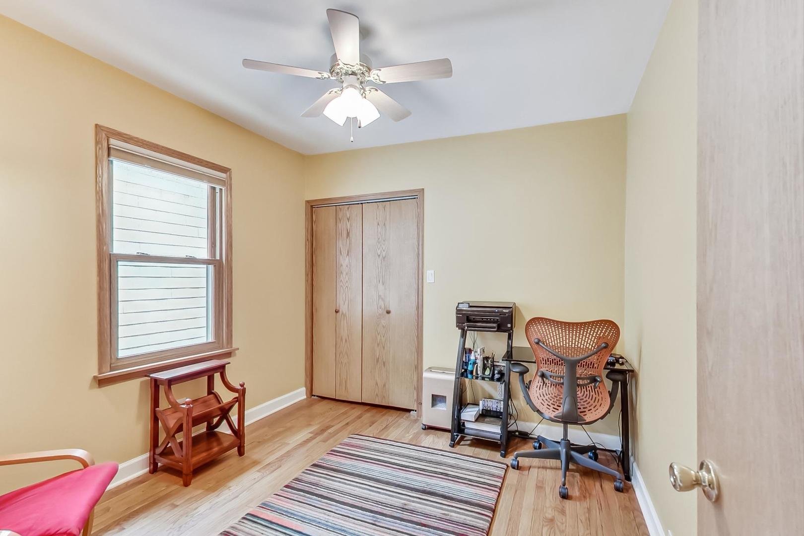 6322 West Huntington Street Chicago, IL 60646 - Photo 19 of 51 a view of a room with lounge chair and wooden floor