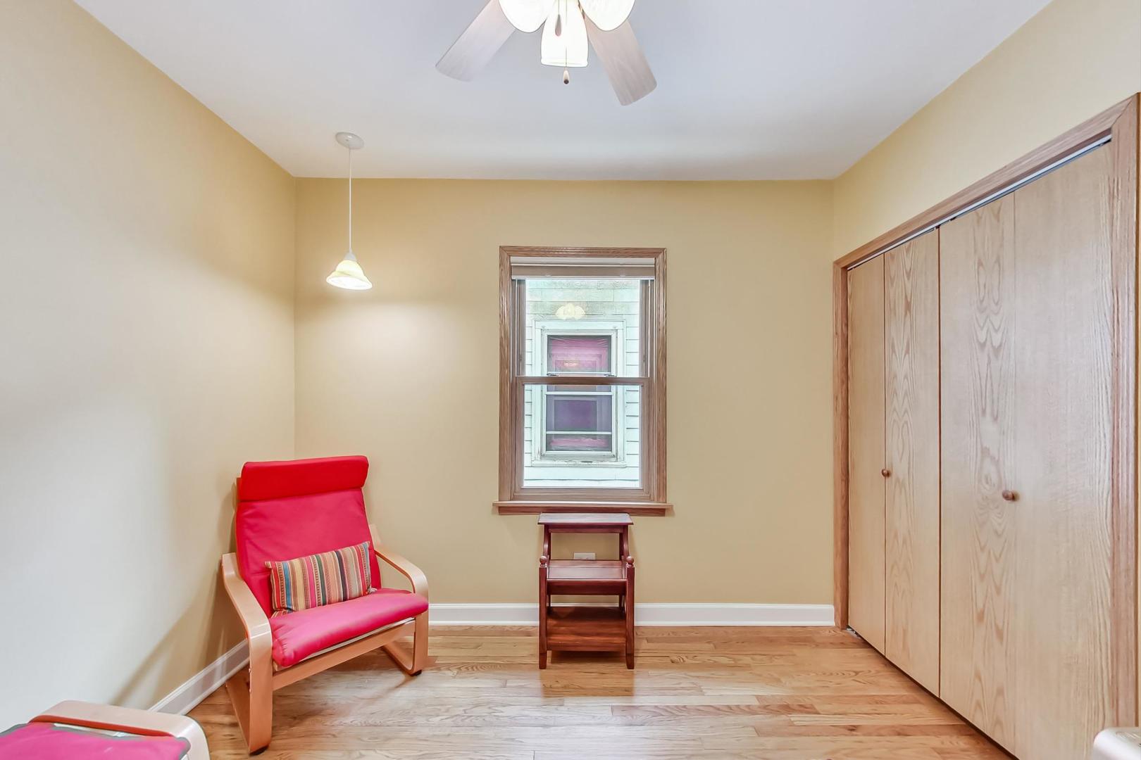 6322 West Huntington Street Chicago, IL 60646 - Photo 20 of 51 a living room with furniture and a window
