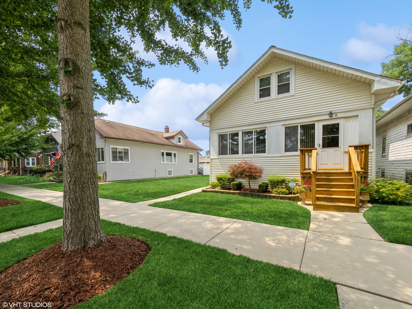 6322 West Huntington Street Chicago, IL 60646 - Photo 2 of 51 a front view of a house with a yard and trees