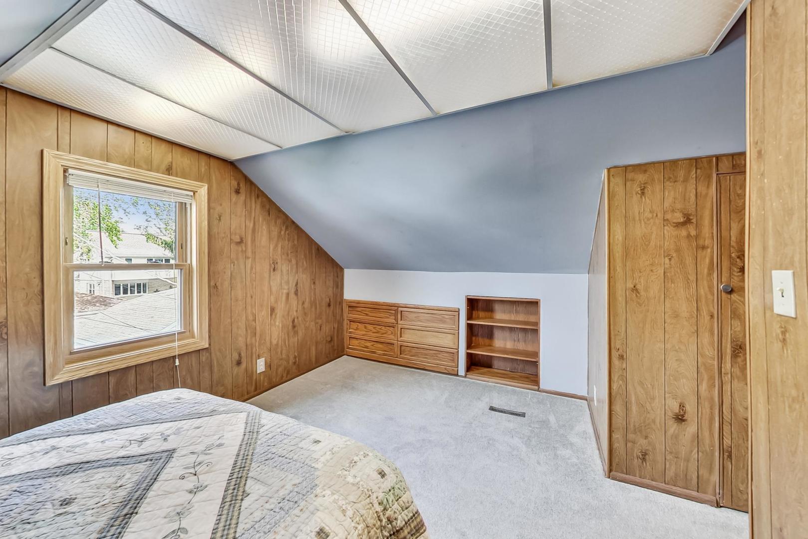 6322 West Huntington Street Chicago, IL 60646 - Photo 26 of 51 a bedroom with a bed and a window
