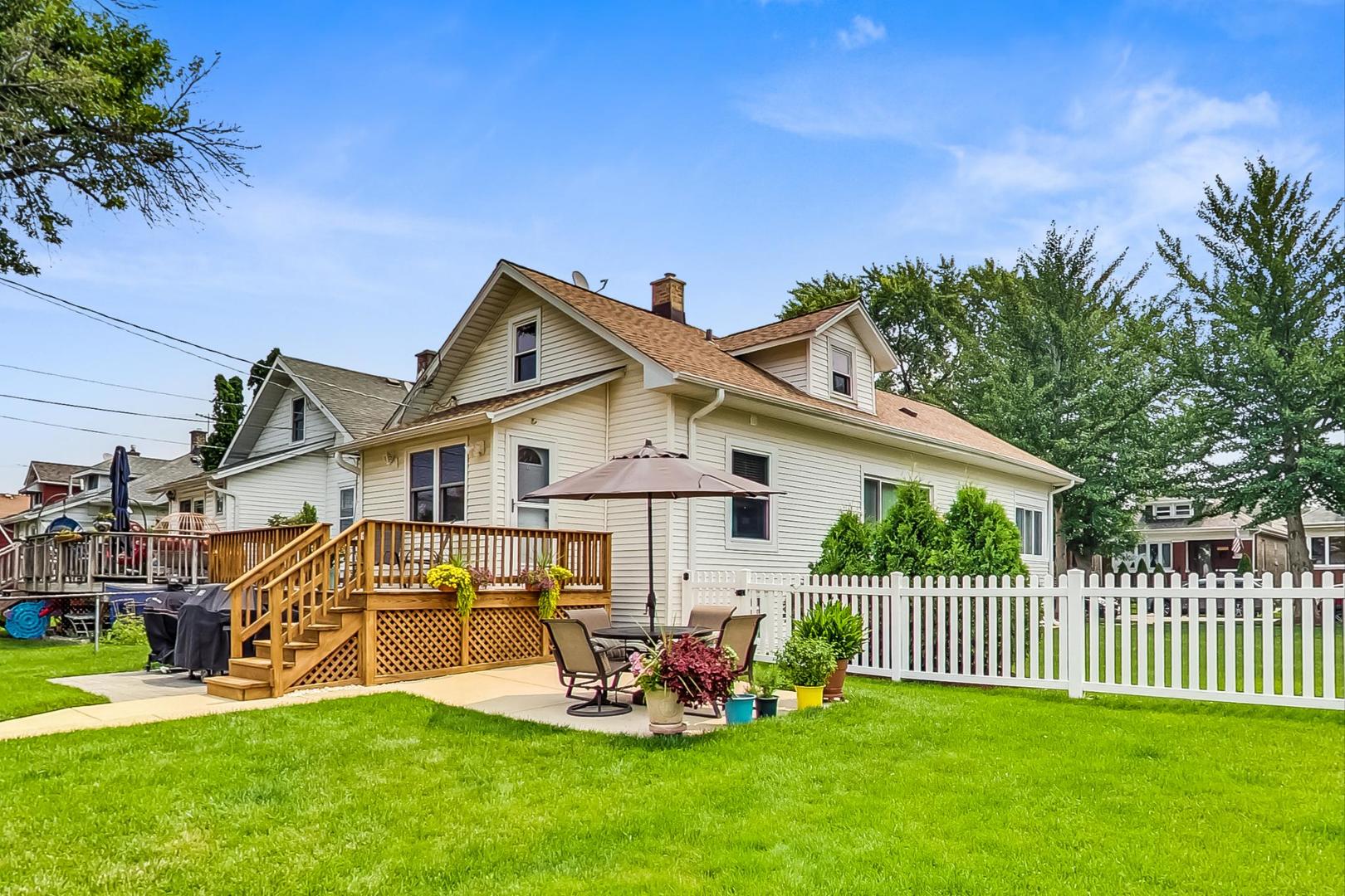 6322 West Huntington Street Chicago, IL 60646 - Photo 37 of 51 a view of a house with a yard porch and sitting area