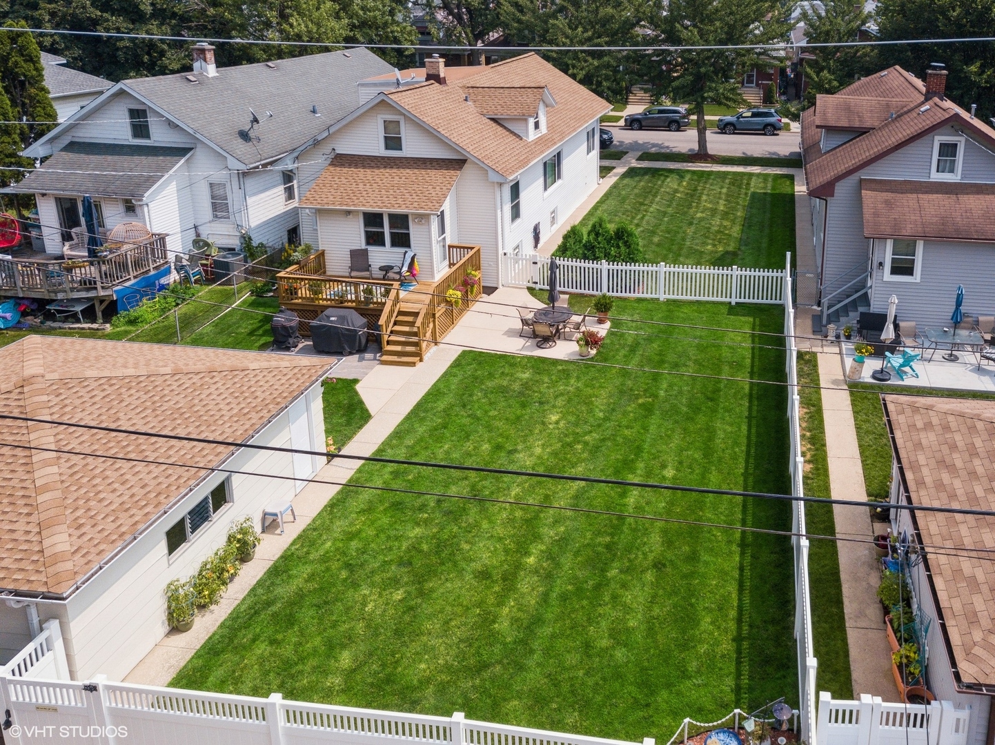 6322 West Huntington Street Chicago, IL 60646 - Photo 50 of 51 a aerial view of multiple houses with a yard