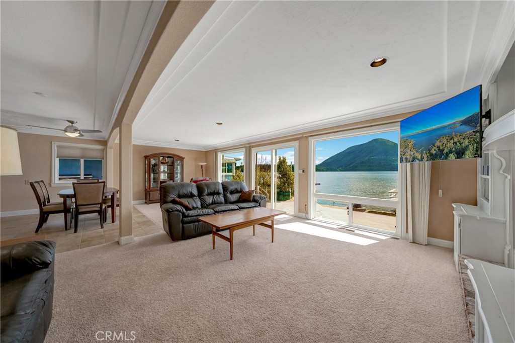 7753 Cora Drive Lucerne, CA 95458 - Photo 11 of 36 a living room with furniture and large windows