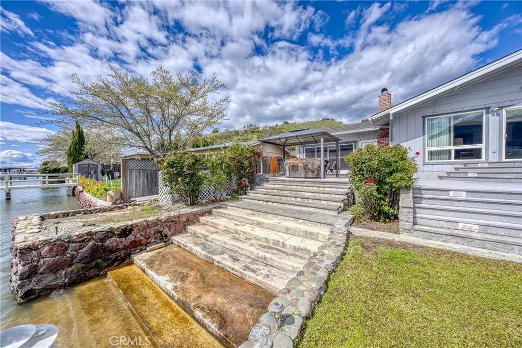 7753 Cora Drive Lucerne, CA 95458 - Photo 30 of 36 a view of a house with backyard and sitting area