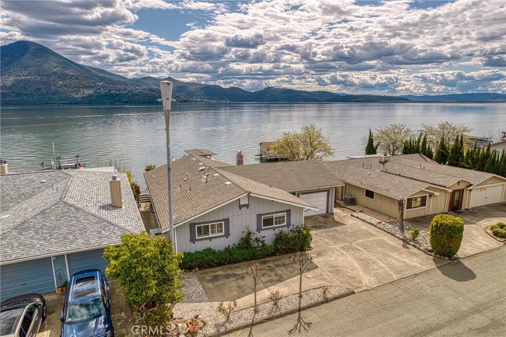 7753 Cora Drive Lucerne, CA 95458 - Photo 3 of 36 a aerial view of a house with a lake view