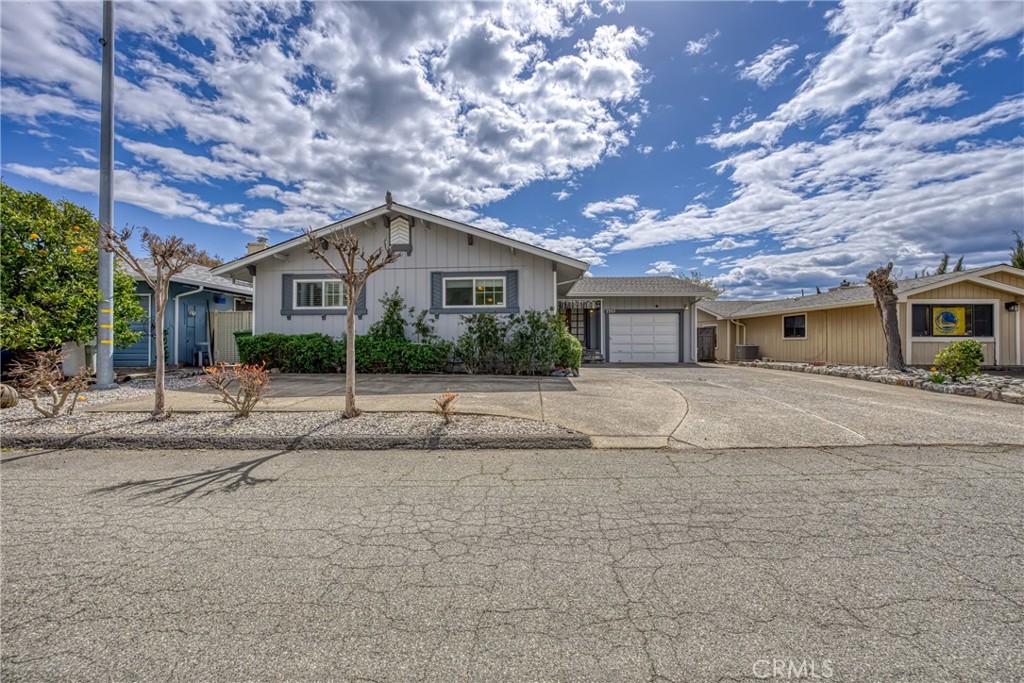 7753 Cora Drive Lucerne, CA 95458 - Photo 6 of 36 a front view of a house with a yard and potted plants