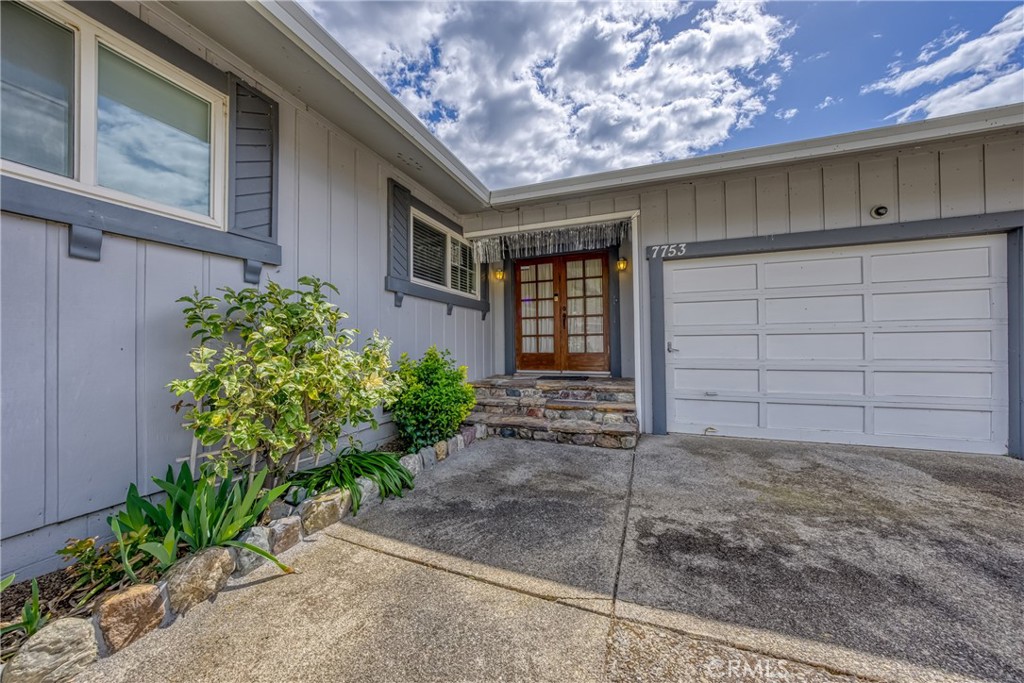 7753 Cora Drive Lucerne, CA 95458 - Photo 7 of 36 a front view of a house with garden