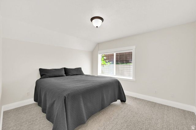 13658 South Fort Street Draper, UT 84020 - Photo 39 of 87 Bright bedroom featuring a single window with blinds, neutral wall paint, white trim, and light-colored carpet flooring