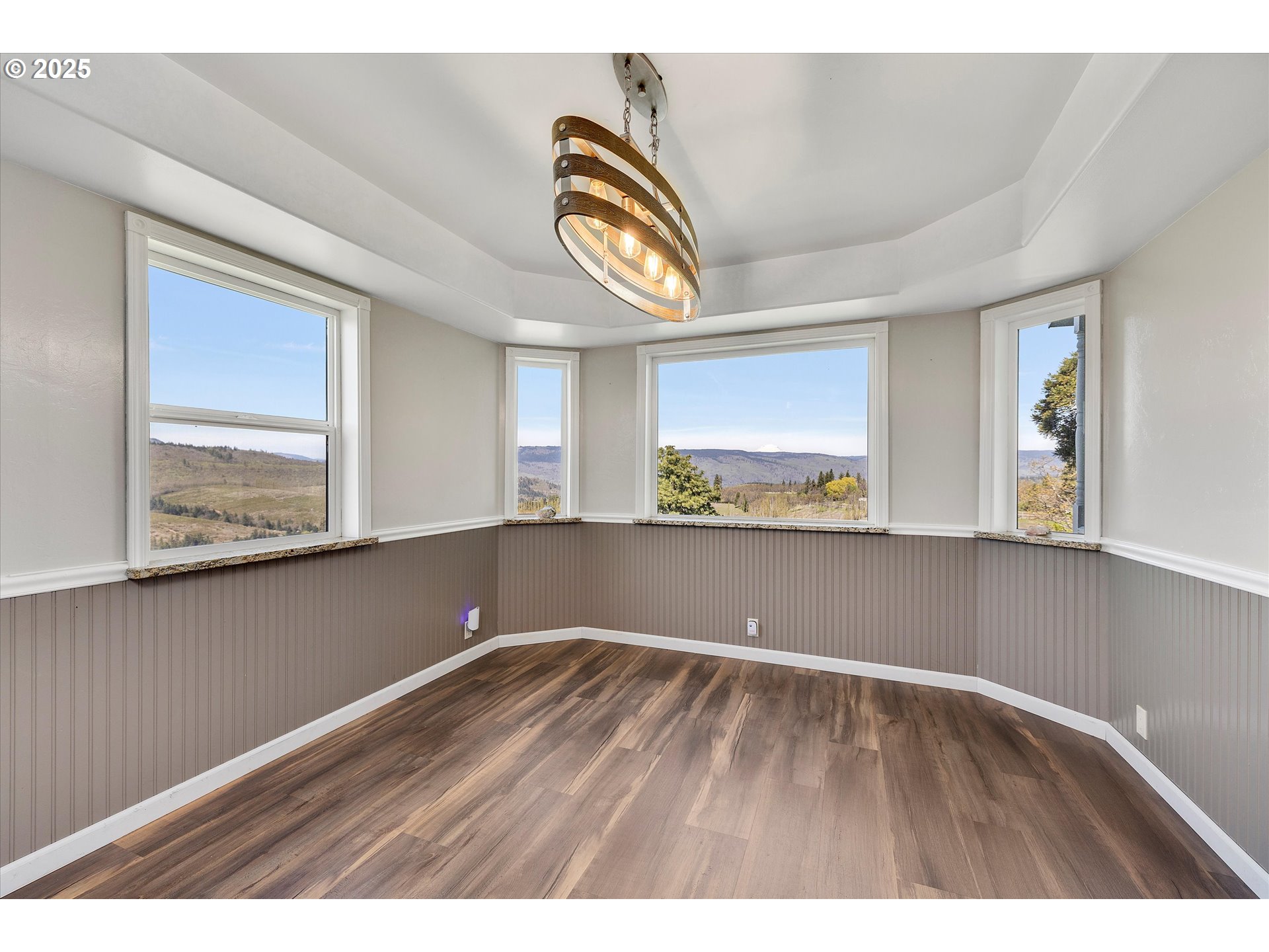 1805 Carroll Road Mosier, OR 97040 - Photo 15 of 45 a view of an empty room with wooden floor and a window