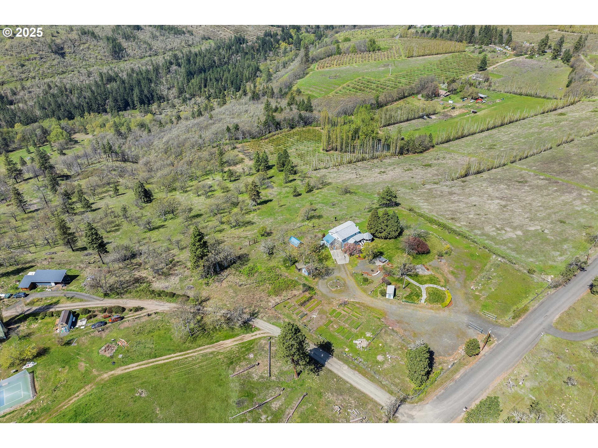 1805 Carroll Road Mosier, OR 97040 - Photo 2 of 45 a view of a yard with a garden