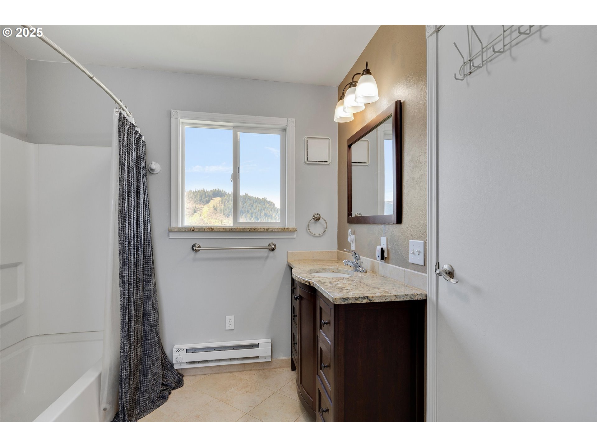 1805 Carroll Road Mosier, OR 97040 - Photo 25 of 45 a bathroom with a granite countertop sink mirror and a window