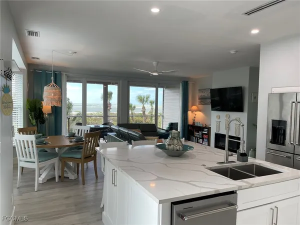 a kitchen with a sink and a refrigerator