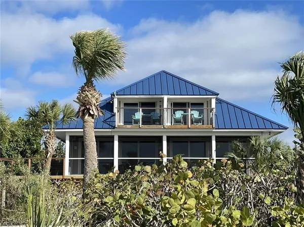 front view of a house with a garden