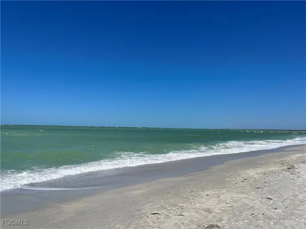 a view of a beach with a ocean view