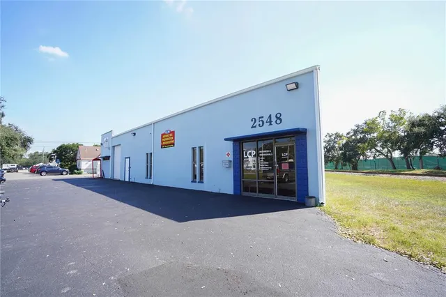 a view of a house with an outdoor space and barbecue grill
