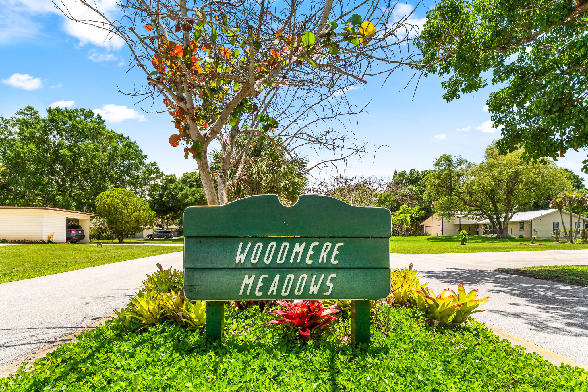1653 Southwest 85th Terrace Stuart, FL 34997 - Photo 52 of 54 a view of a street with a tree in the background