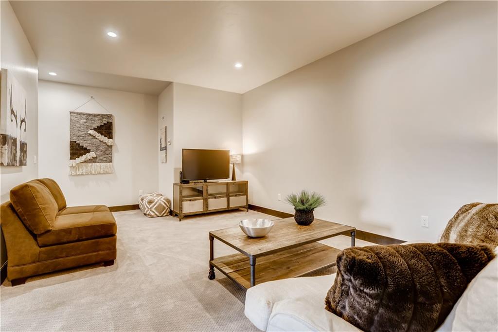 862 Independence Road, Unit 2B Keystone, CO 80435 - Photo 22 of 33 a living room with furniture a couch and a flat screen tv