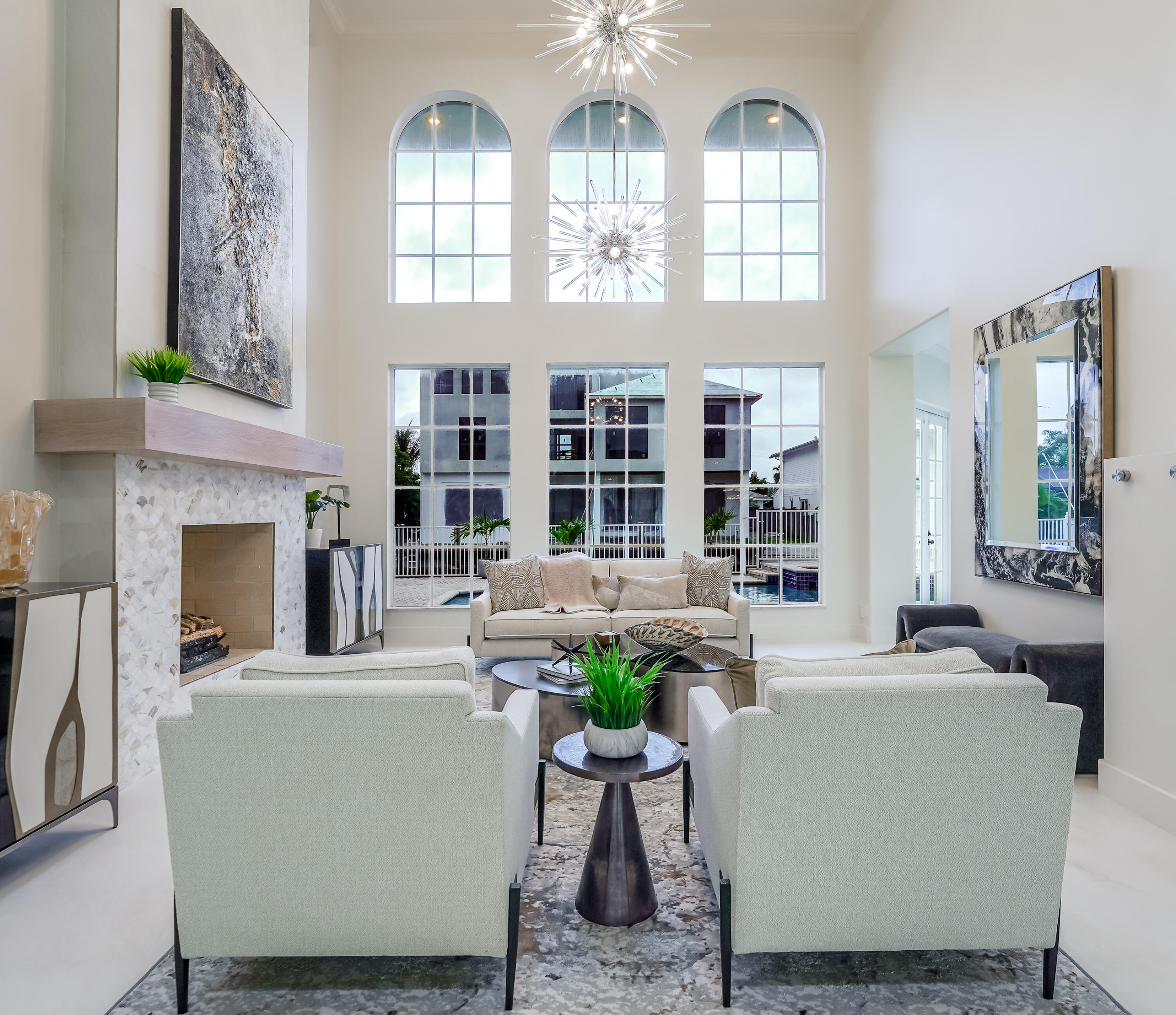 749 Northeast 71st Street Boca Raton, FL 33487 - Photo 3 of 43 a dining room with furniture a fireplace and wooden floor