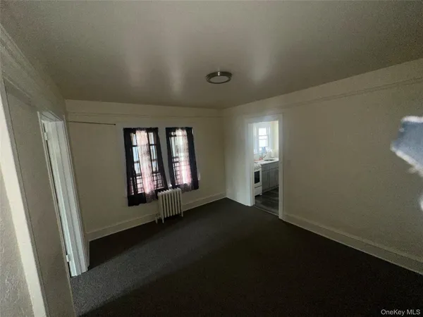 a view of an empty room and window