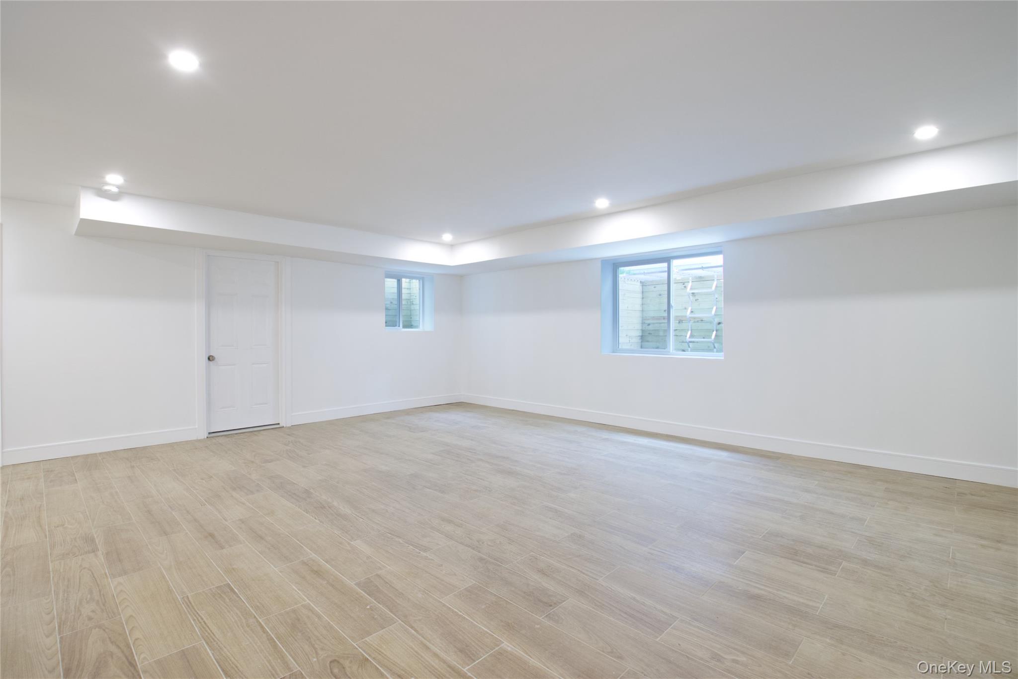 30 Kirkwood Road, Unit B Port Washington, NY 11050 - Photo 31 of 36 a view of an empty room with a window