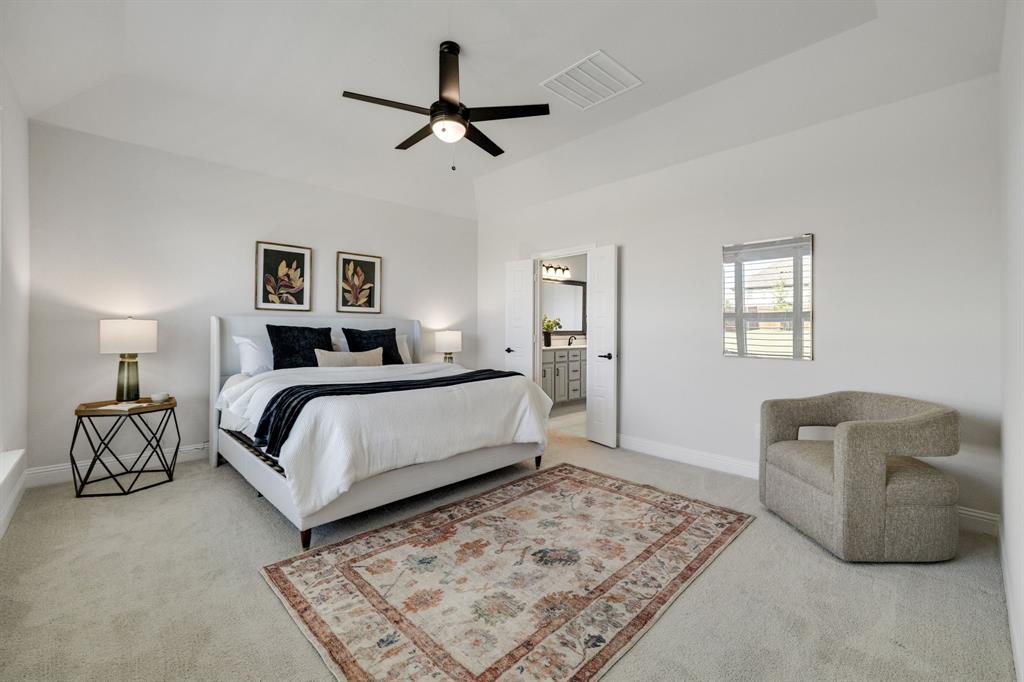 707 Soprano Drive Forney, TX 75126 - Photo 17 of 37 a bedroom with a bed couches chair and a window