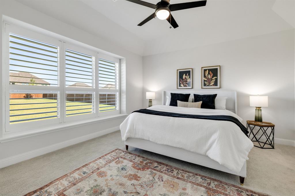 707 Soprano Drive Forney, TX 75126 - Photo 18 of 37 a bedroom with a large bed and a window