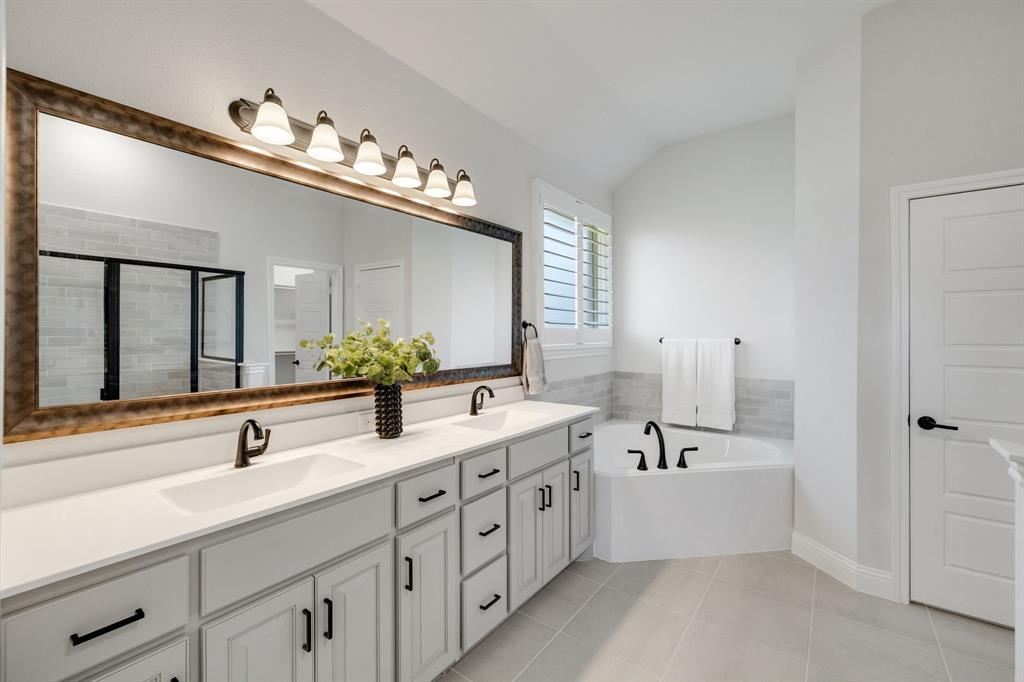 707 Soprano Drive Forney, TX 75126 - Photo 20 of 37 a spacious bathroom with double sink and a large mirror