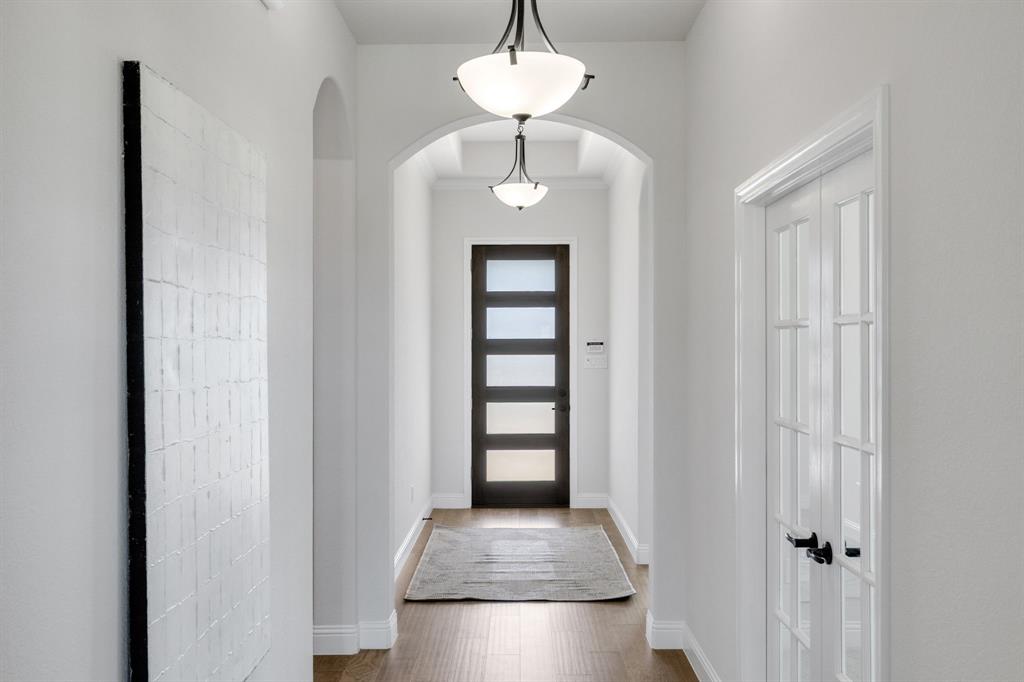 707 Soprano Drive Forney, TX 75126 - Photo 2 of 37 a view of an entryway with a window and wooden floor