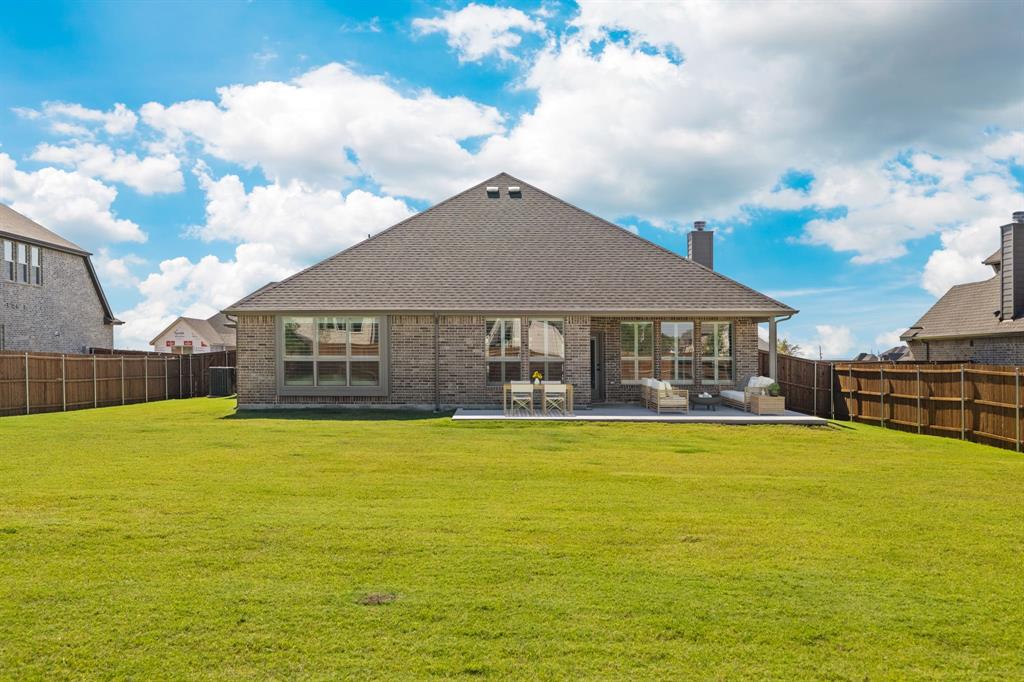707 Soprano Drive Forney, TX 75126 - Photo 34 of 37 a view of a house with a yard