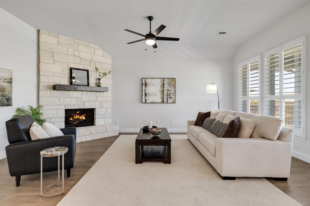 707 Soprano Drive Forney, TX 75126 - Photo 4 of 37 a living room with furniture and a fireplace