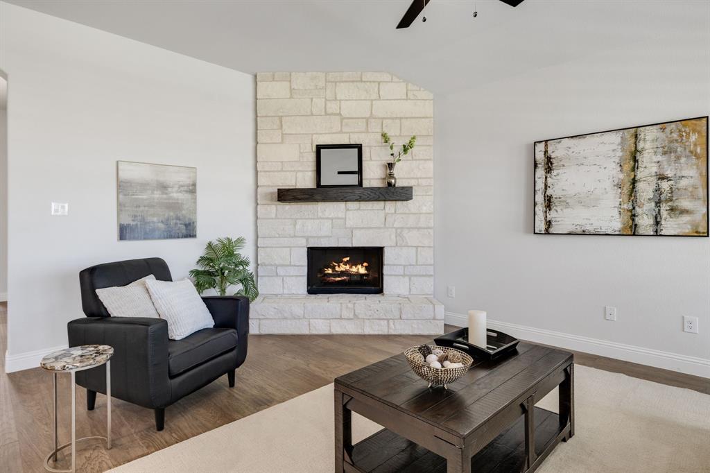 707 Soprano Drive Forney, TX 75126 - Photo 7 of 37 a living room with furniture and a fireplace