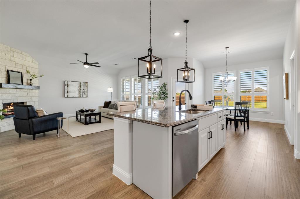 707 Soprano Drive Forney, TX 75126 - Photo 10 of 37 a kitchen with sink and refrigerator
