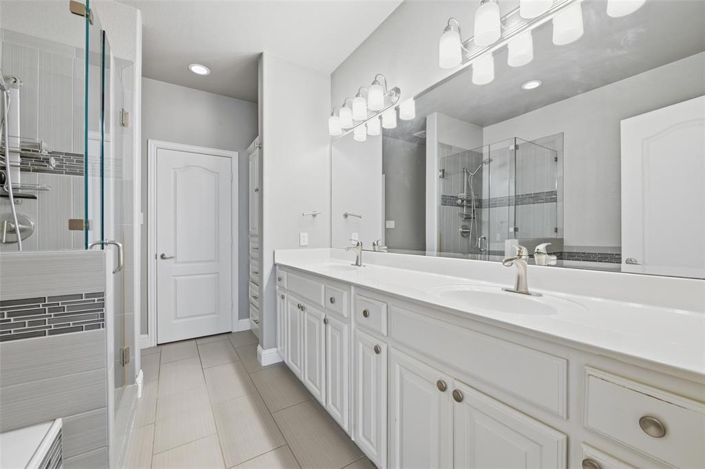 722 East 1st Street Fort Worth, TX 76102 - Photo 16 of 30 The updated primary bathroom features modern finishes and a fresh, clean design.