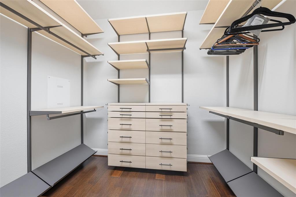 722 East 1st Street Fort Worth, TX 76102 - Photo 18 of 30 The upgraded primary closet features a custom storage system by The Container Store with built-in drawers and shelving for maximum organization.