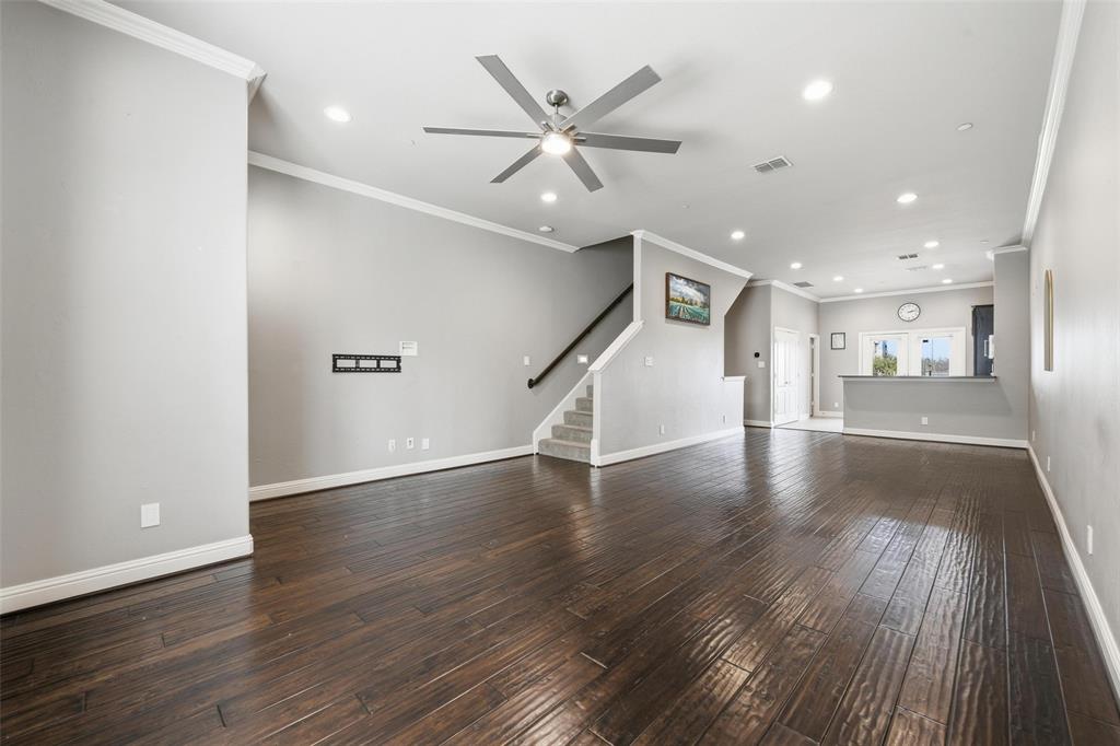 722 East 1st Street Fort Worth, TX 76102 - Photo 9 of 30 This smart home showcases sleek light fixtures, recessed lighting, and crown molding throughout, adding timeless character.