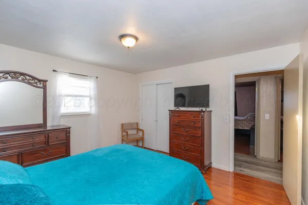 a bedroom with a bed and furniture