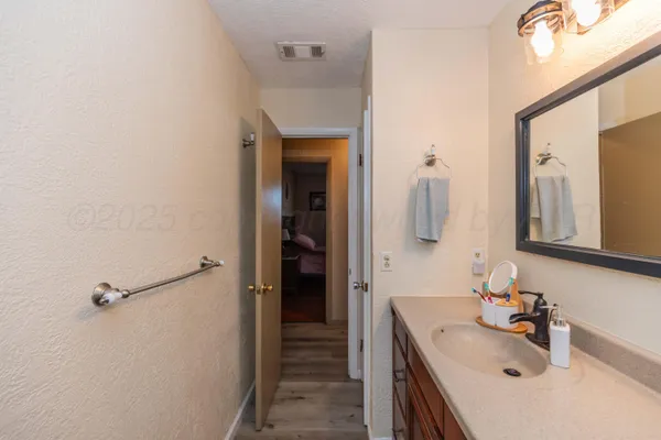 a bathroom with a sink and mirror