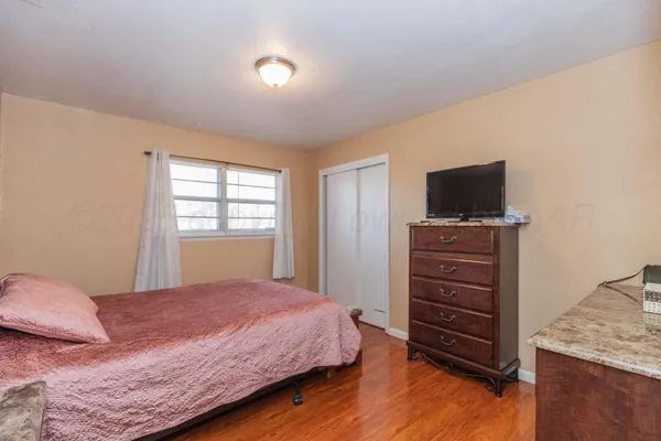 a bedroom with a bed and furniture