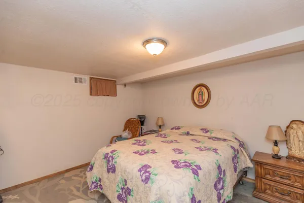 a bedroom with a bed and a table
