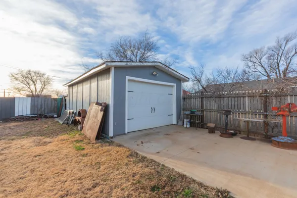 a view of a house with a backyard of the house