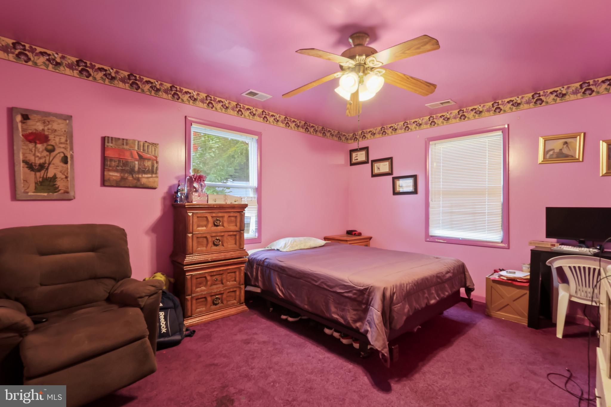 32 Ruby Street Springfield, NJ 07081 - Photo 12 of 31 a bedroom with a bed and a couch