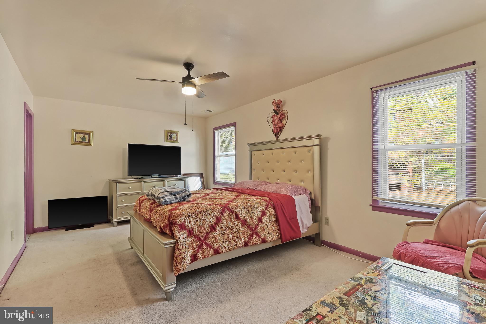 32 Ruby Street Springfield, NJ 07081 - Photo 16 of 31 a bedroom with a bed and a flat screen tv