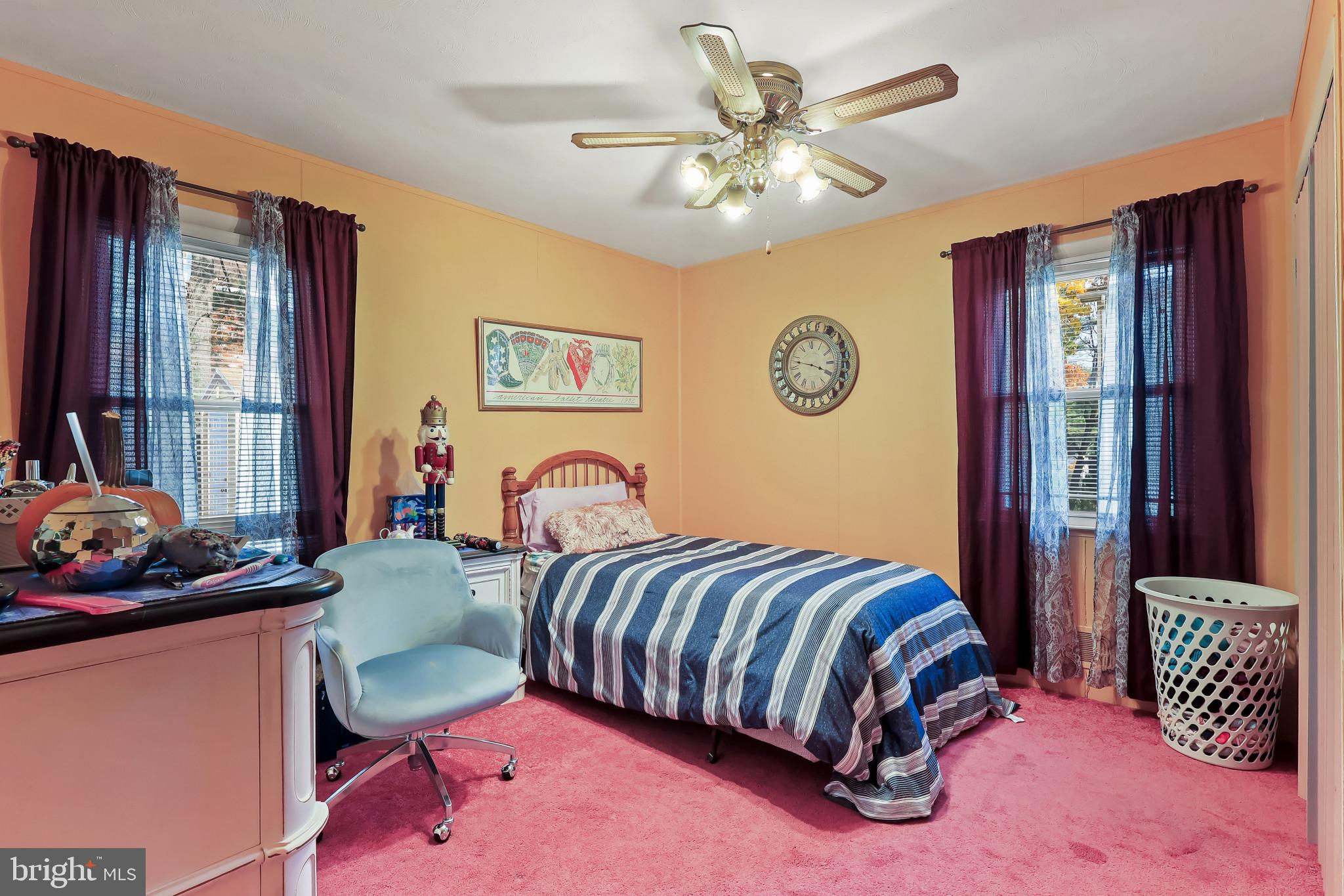 32 Ruby Street Springfield, NJ 07081 - Photo 18 of 33 a bedroom with a bed and a chandelier