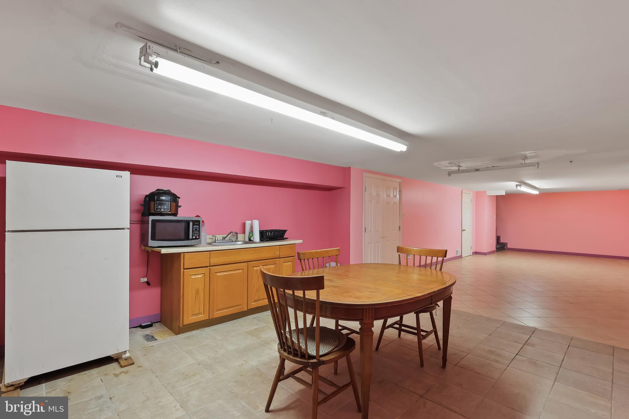 32 Ruby Street Springfield, NJ 07081 - Photo 28 of 31 a kitchen with a dining table and chairs
