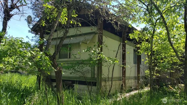 a backyard of a house with lots of green space