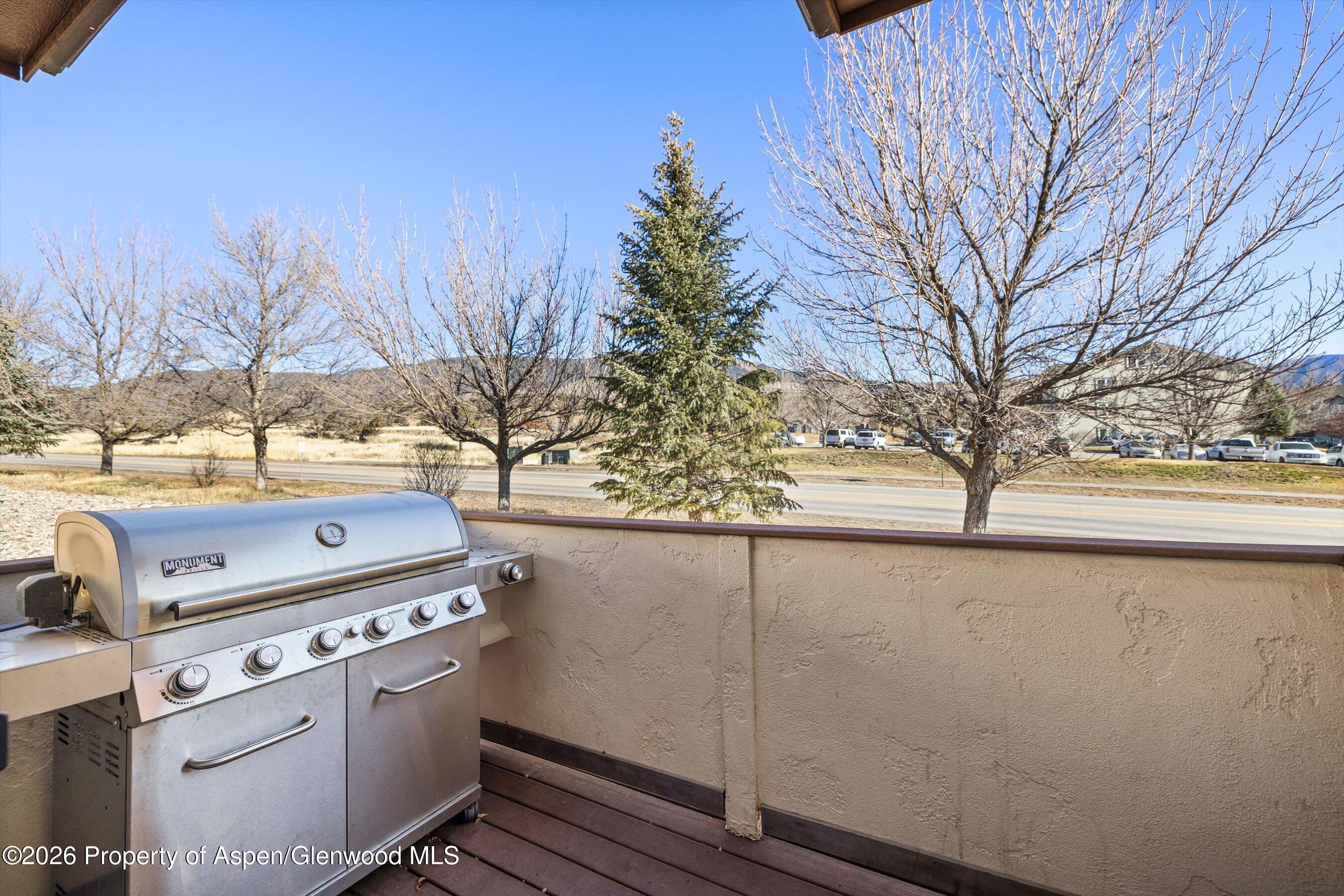 66 Castle Ridge Drive New Castle, CO 81647 - Photo 18 of 23 a view of washer and dryer with wooden fence