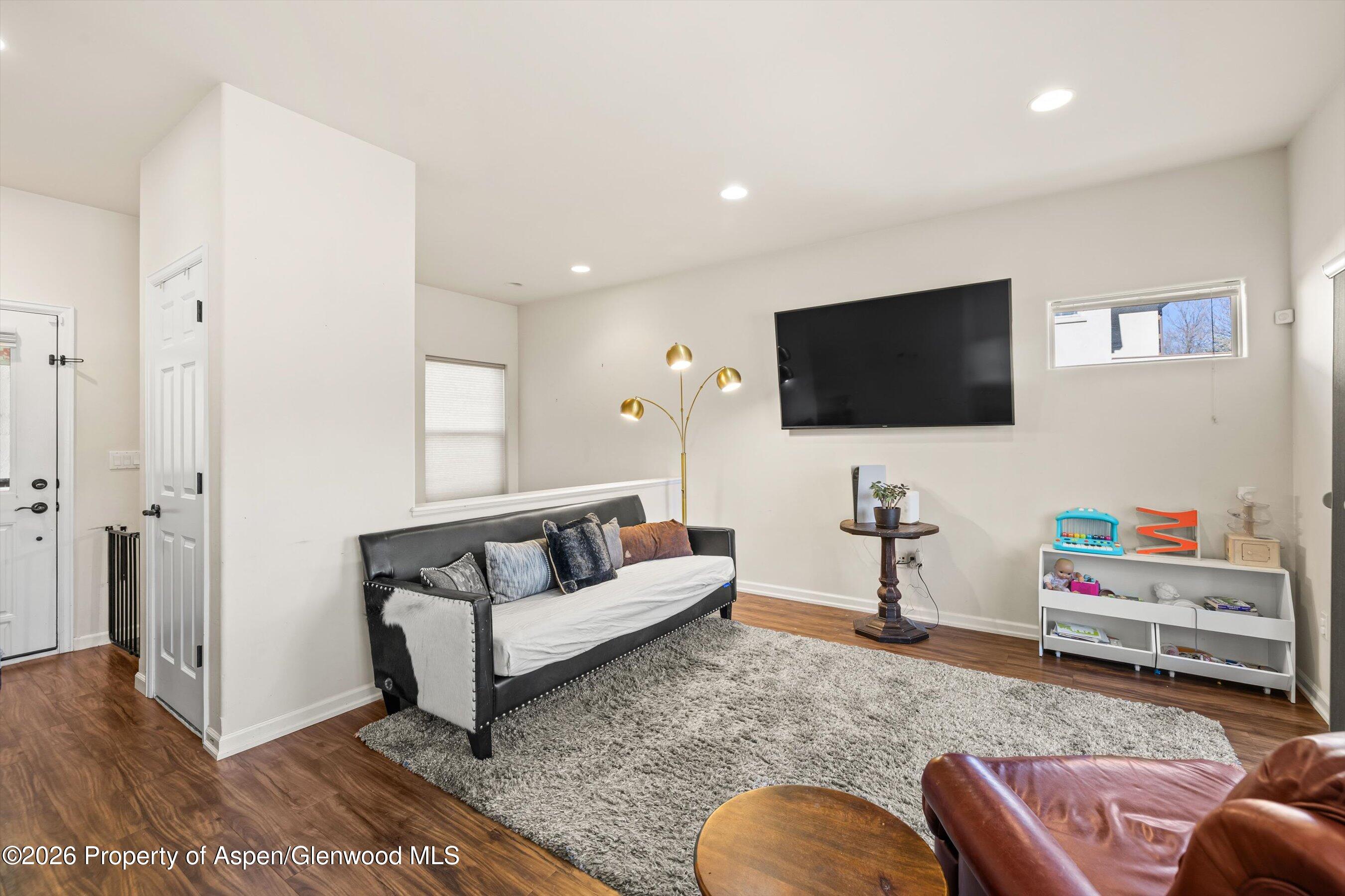 66 Castle Ridge Drive New Castle, CO 81647 - Photo 4 of 23 a living room with furniture and a flat screen tv