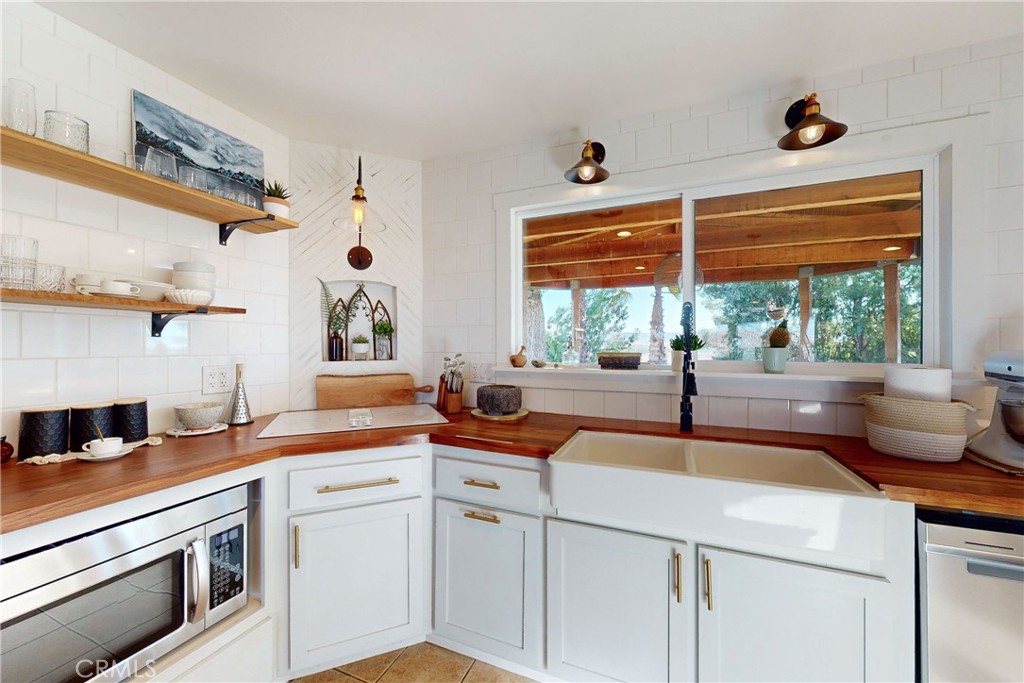 8560 Warren Road Paso Robles, CA 93446 - Photo 16 of 74 a kitchen with a sink and a stove
