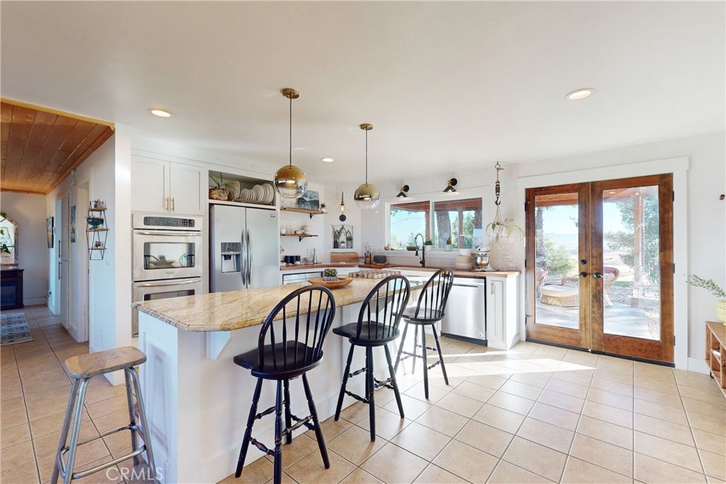 8560 Warren Road Paso Robles, CA 93446 - Photo 18 of 74 Large center island with granite counter top
