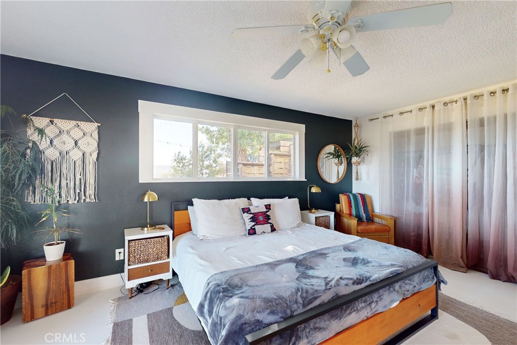 8560 Warren Road Paso Robles, CA 93446 - Photo 24 of 74 a bedroom with a bed a dresser next to a window